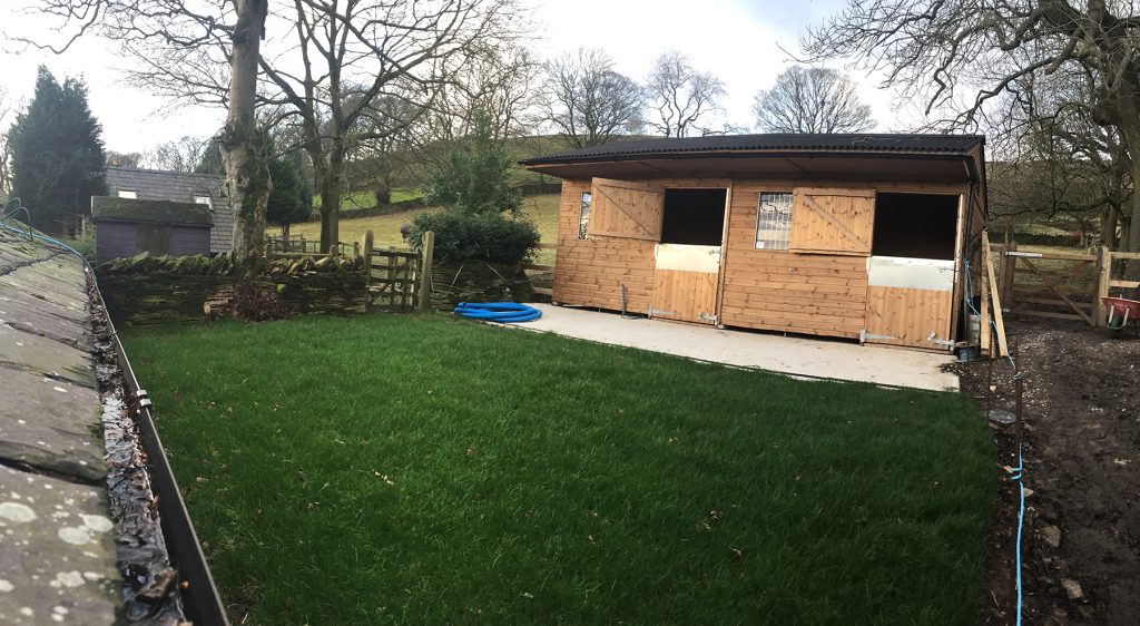 Completed reinforced grass area beside equestrian stables